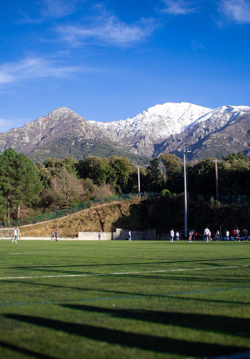 Mountain backdrop football pitch in Corsica with Veo camera capturing a league match